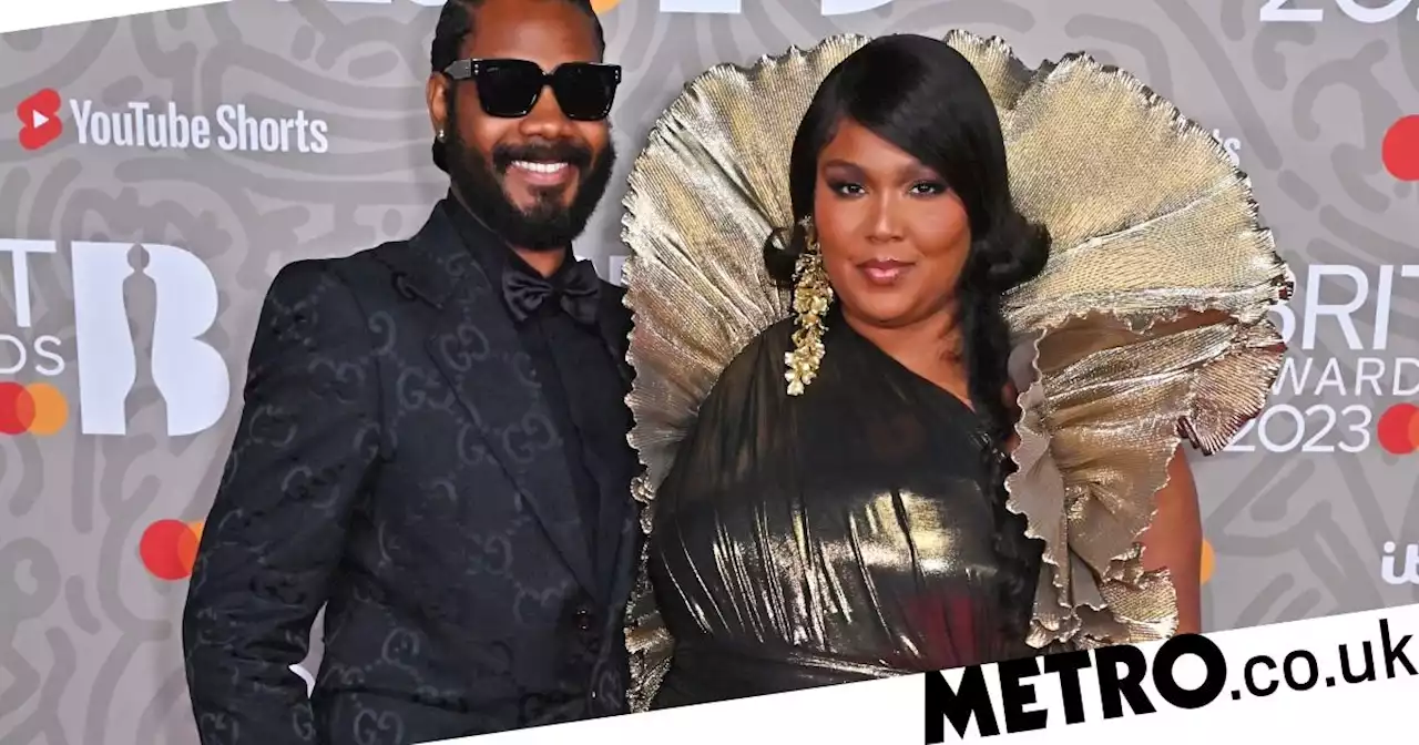 Lizzo looks every inch a golden goddess on Brit Awards red carpet with boyfriend