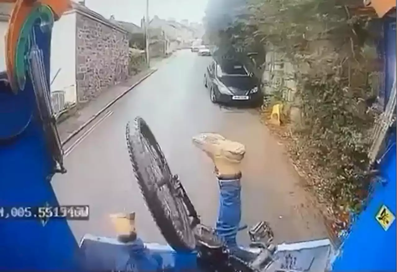 Cyclist's bizarre high-speed crash into bin lorry caught on CCTV