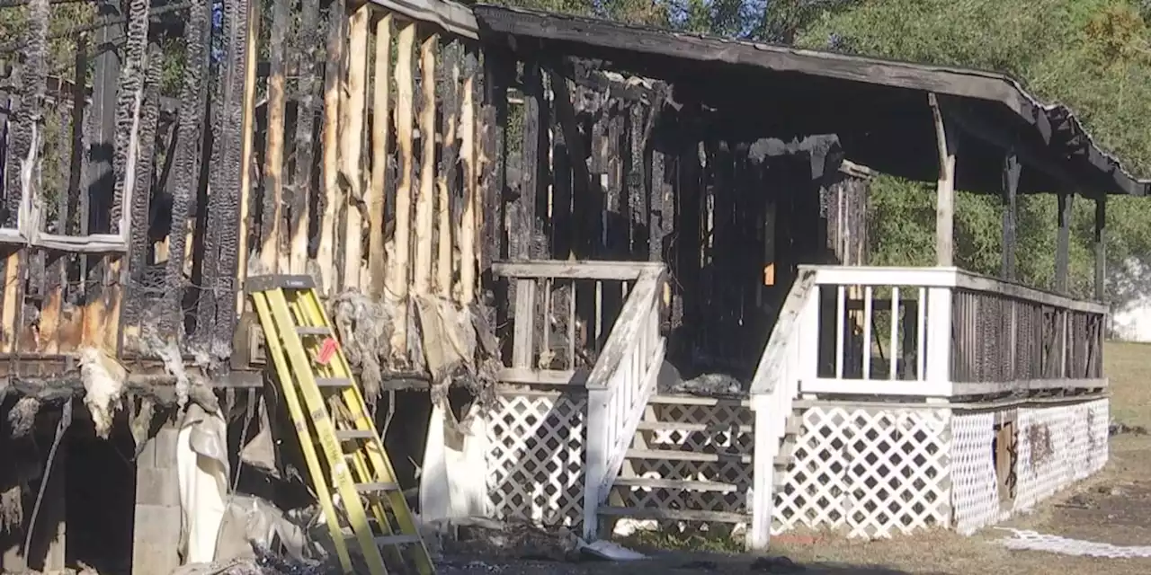 Eight people displaced after Grand Bay mobile home engulfed in flames Sunday