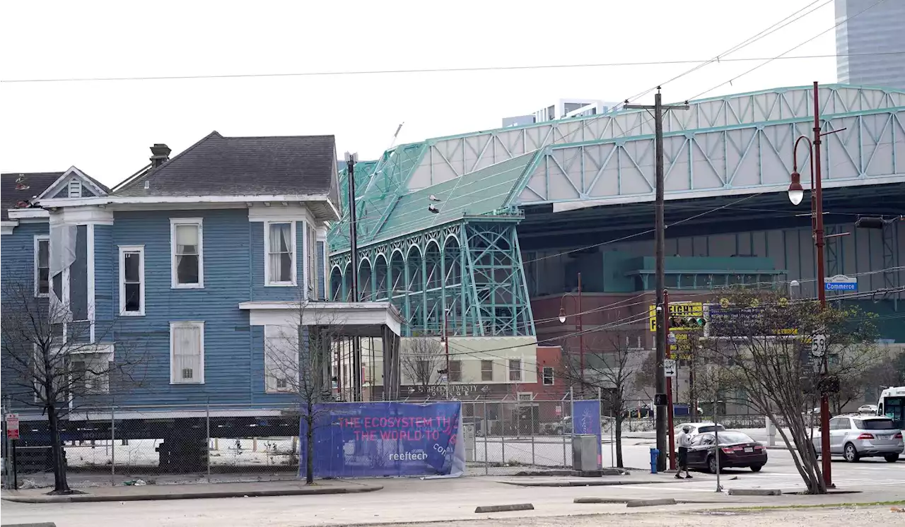 A big and blue bit of Houston history is crashing in a parking lot, for now