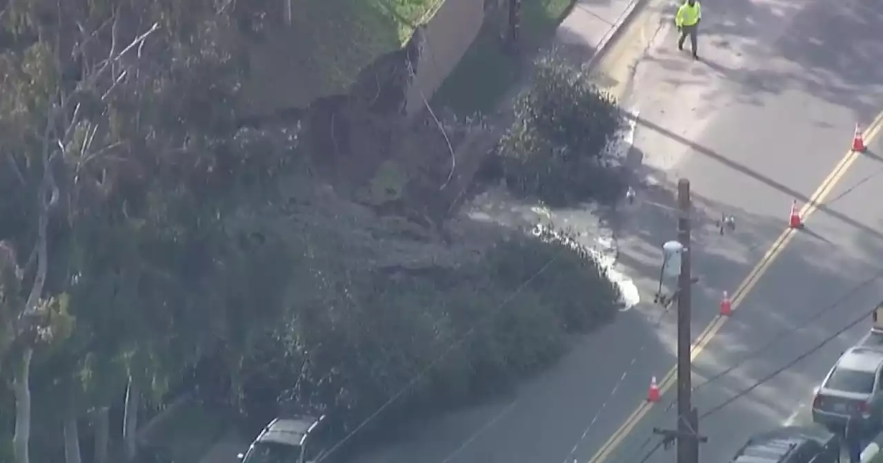 Retaining wall, hillside collapse due to possible water main break