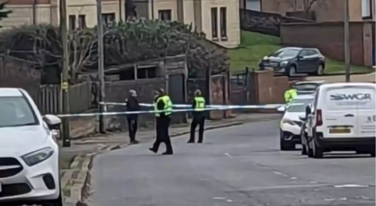 Police lock down Glasgow road after 'man acting suspiciously'