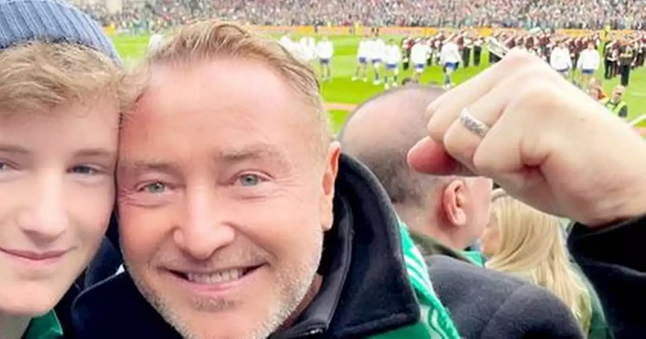 Michael Flatley steps out with teen son as he puts cancer diagnosis to one side