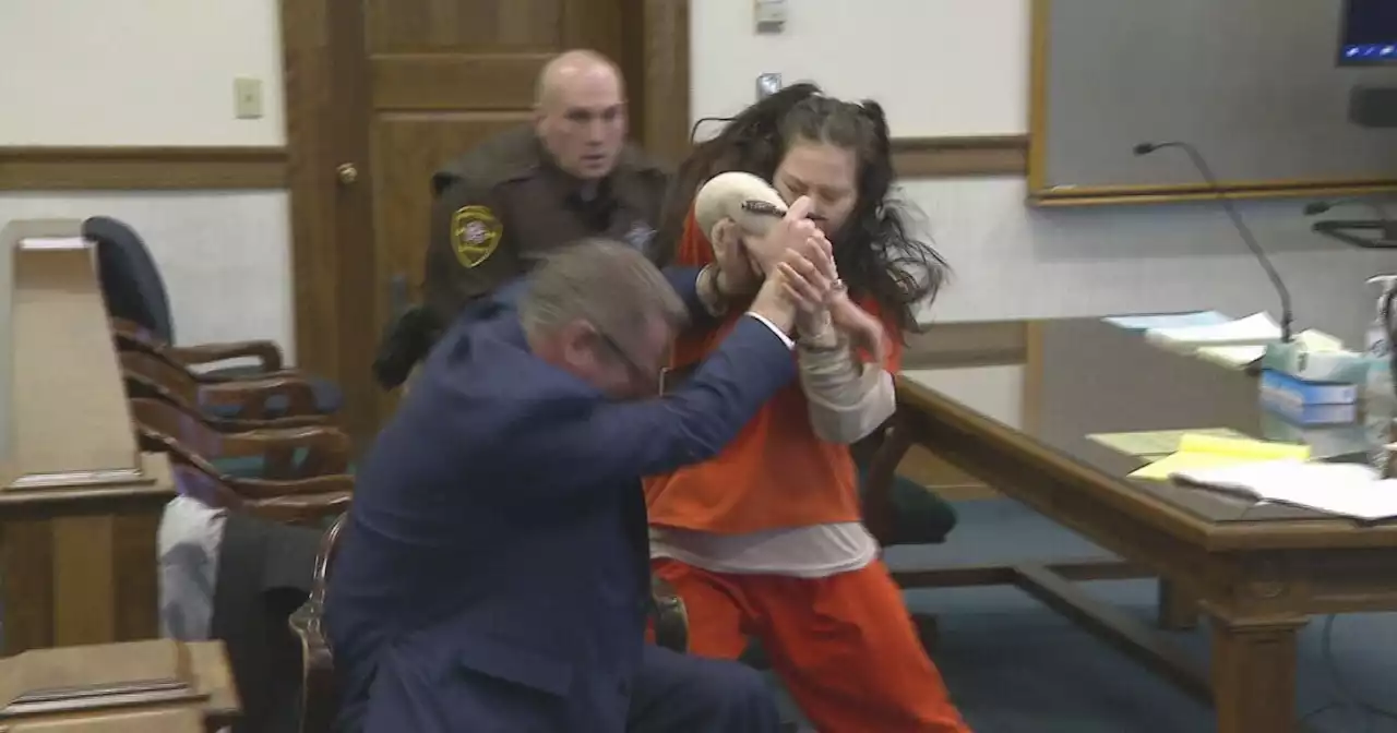 WATCH: Woman accused of dismembering murder victim attacks lawyer in court