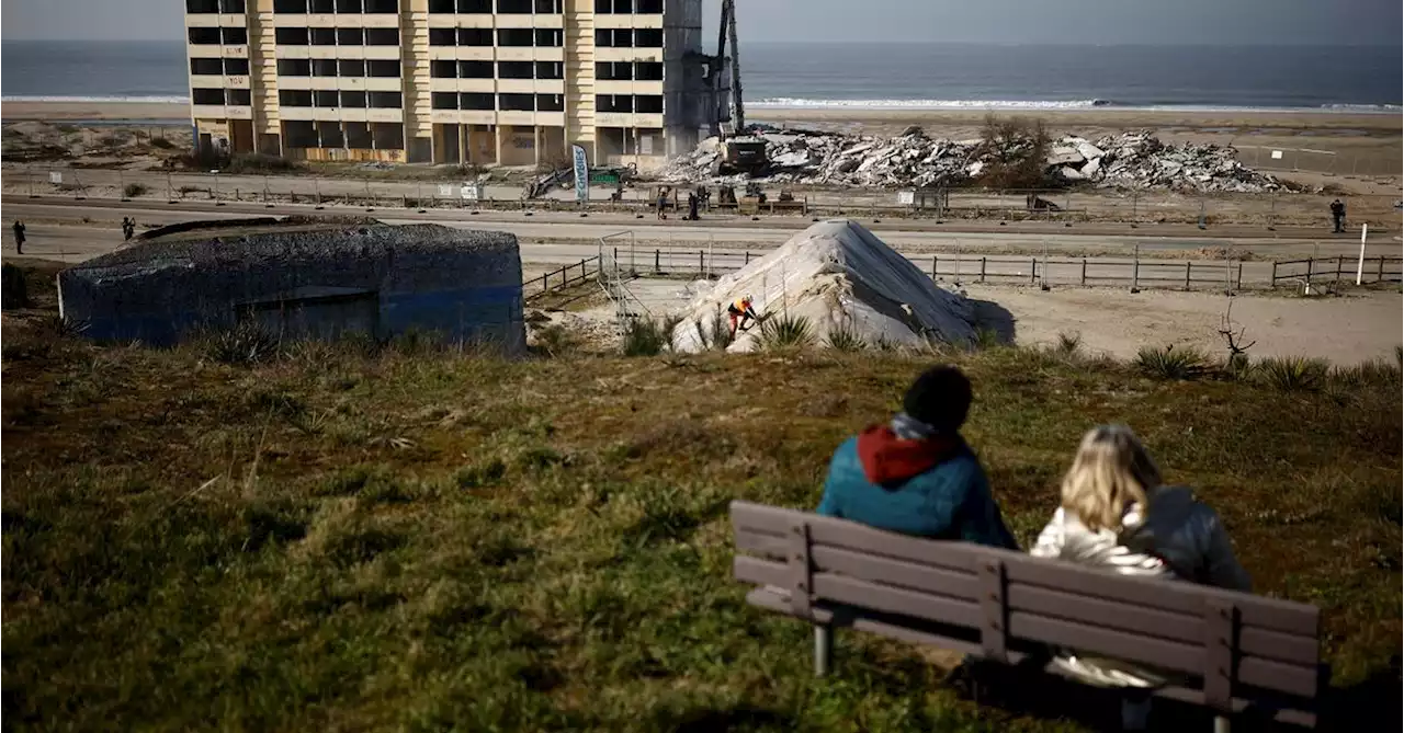 France tears down beach apartment block as rising sea bites