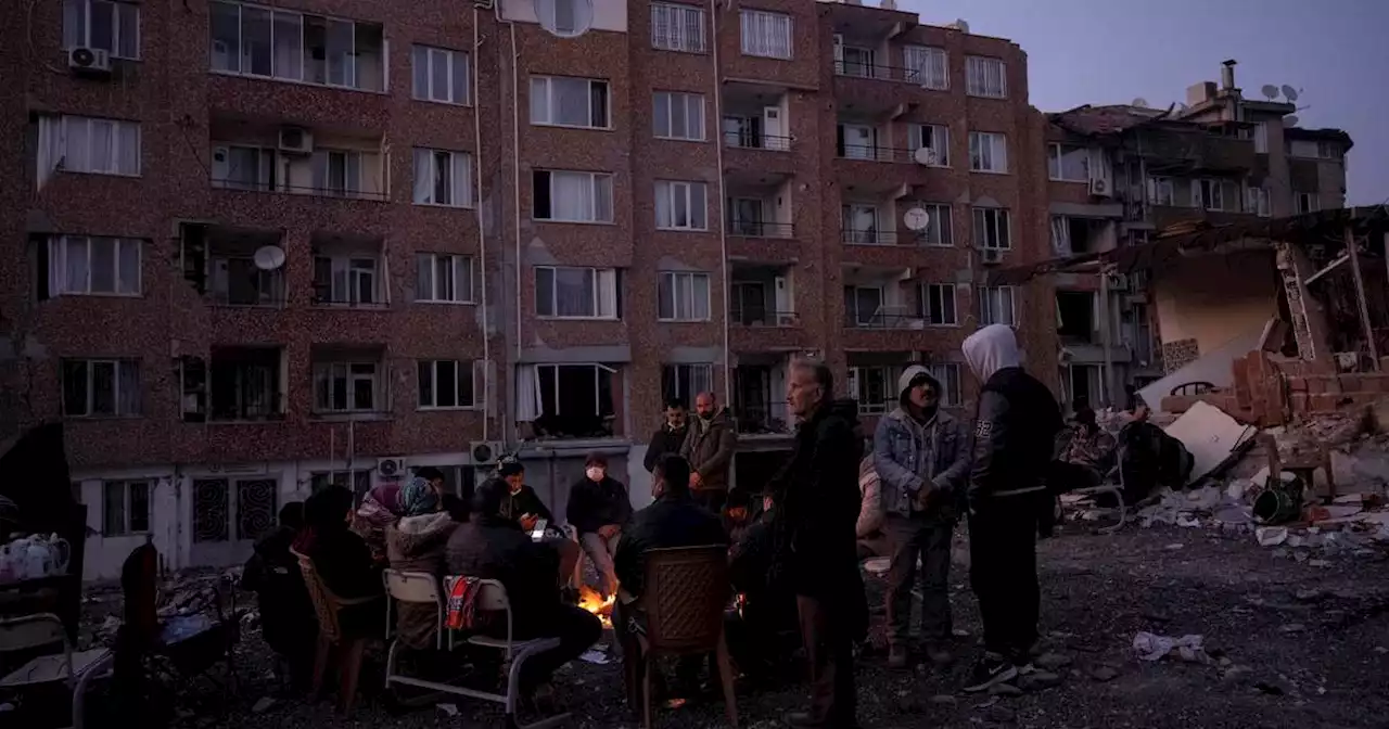 Turkey and Syria earthquake survivors wait amid rubble, to search or say goodbye