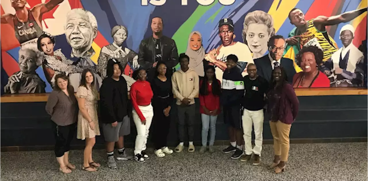 Students and staff celebrating new Black excellence mural at Oshawa secondary school