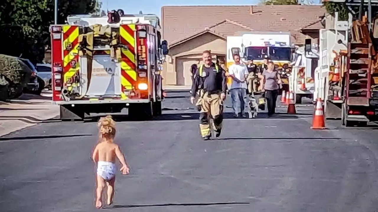 Toddler runs to her firefighter dad in adorable moment