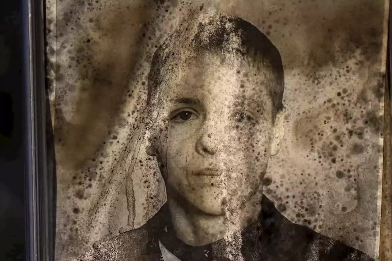 AP PHOTOS: Fading graveside portraits of Ukraine's war dead