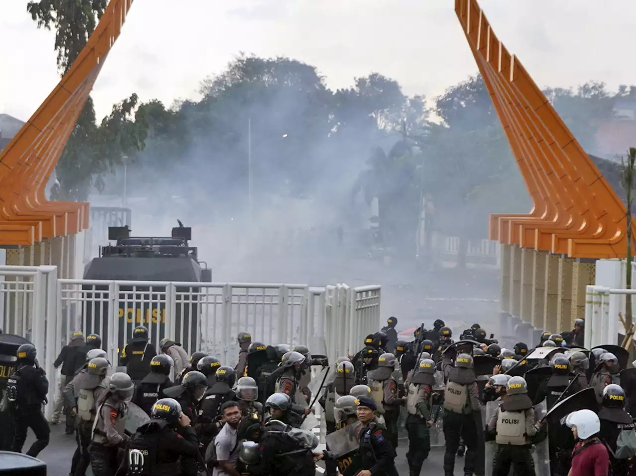 Indonesian police fire tear gas to disperse soccer fans