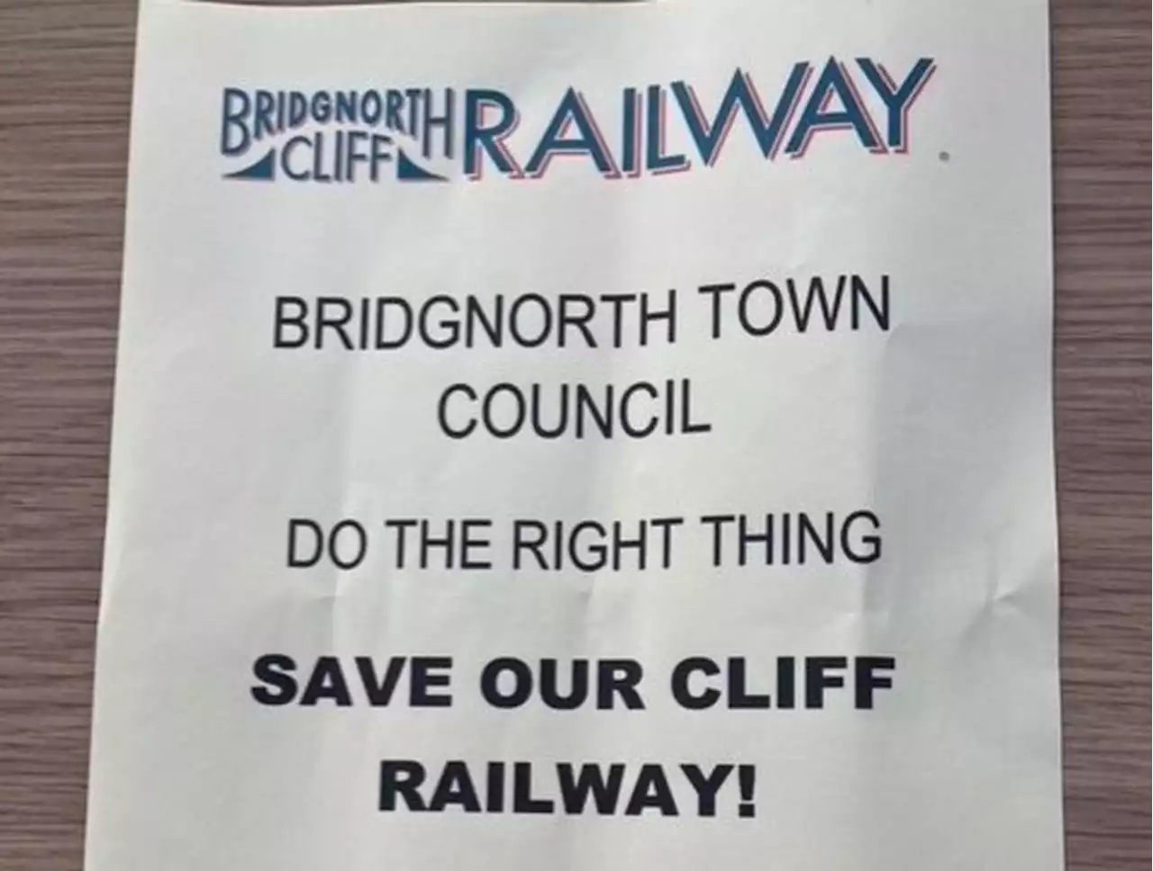 Poster campaign launched by at risk cliff railway staff in row over unsafe wall