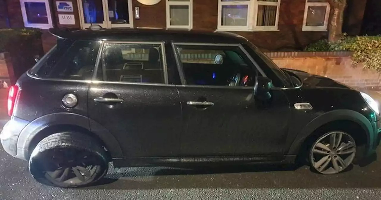 Woman arrested after police spot Mini with tyre 'just about hanging on'