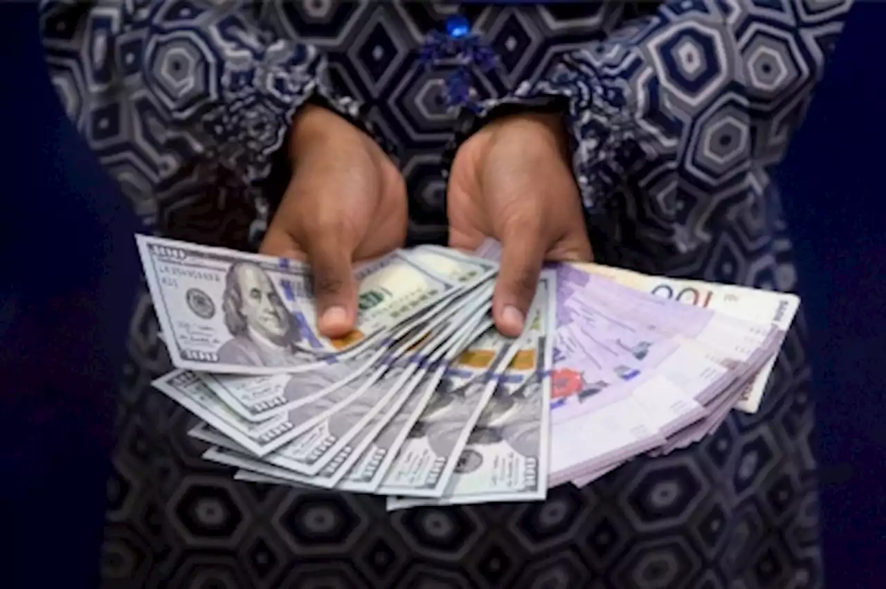 Ringgit ends firmer against US dollar