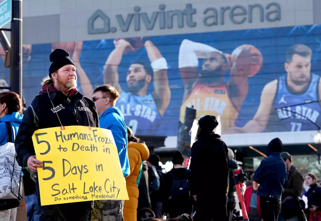 Not out of sight, protesters call attention to homelessness in march outside Vivint Arena