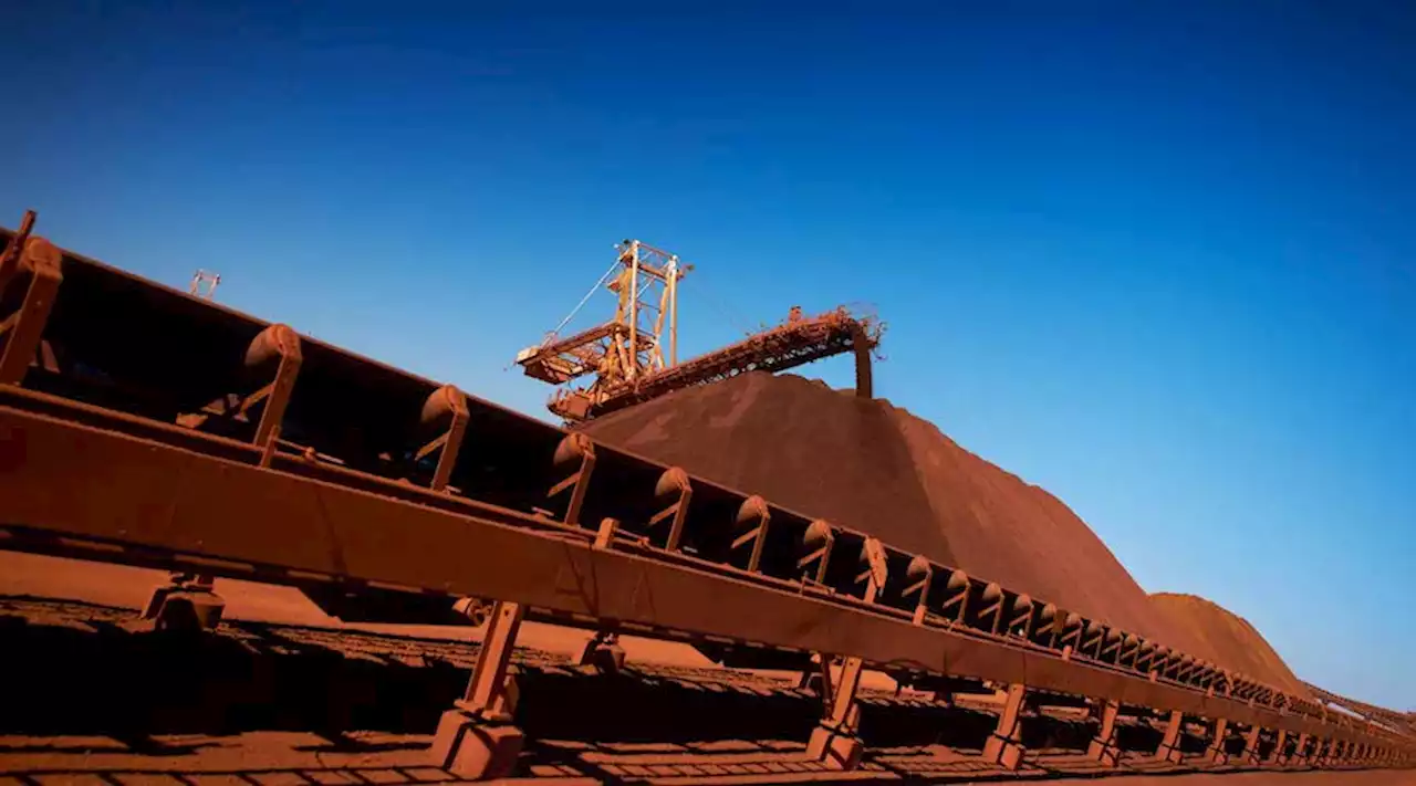 BHP reports 32% drop in first-half profit on low iron ore prices