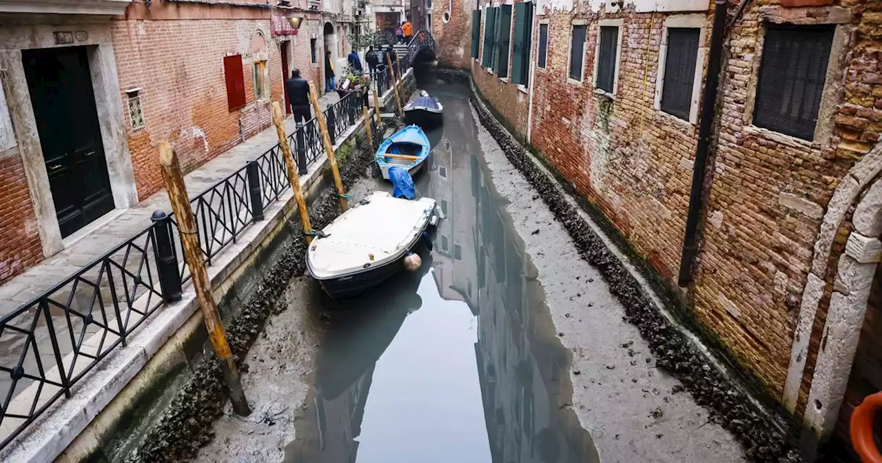 Venice canals run dry as lingering weather system mires tides, and Alps snow shortage fuels concerns for Italy's summer