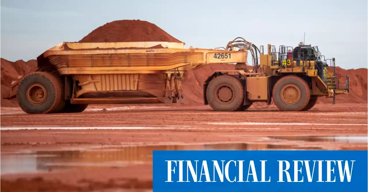 Rio Tinto dividend halves on lower iron ore prices