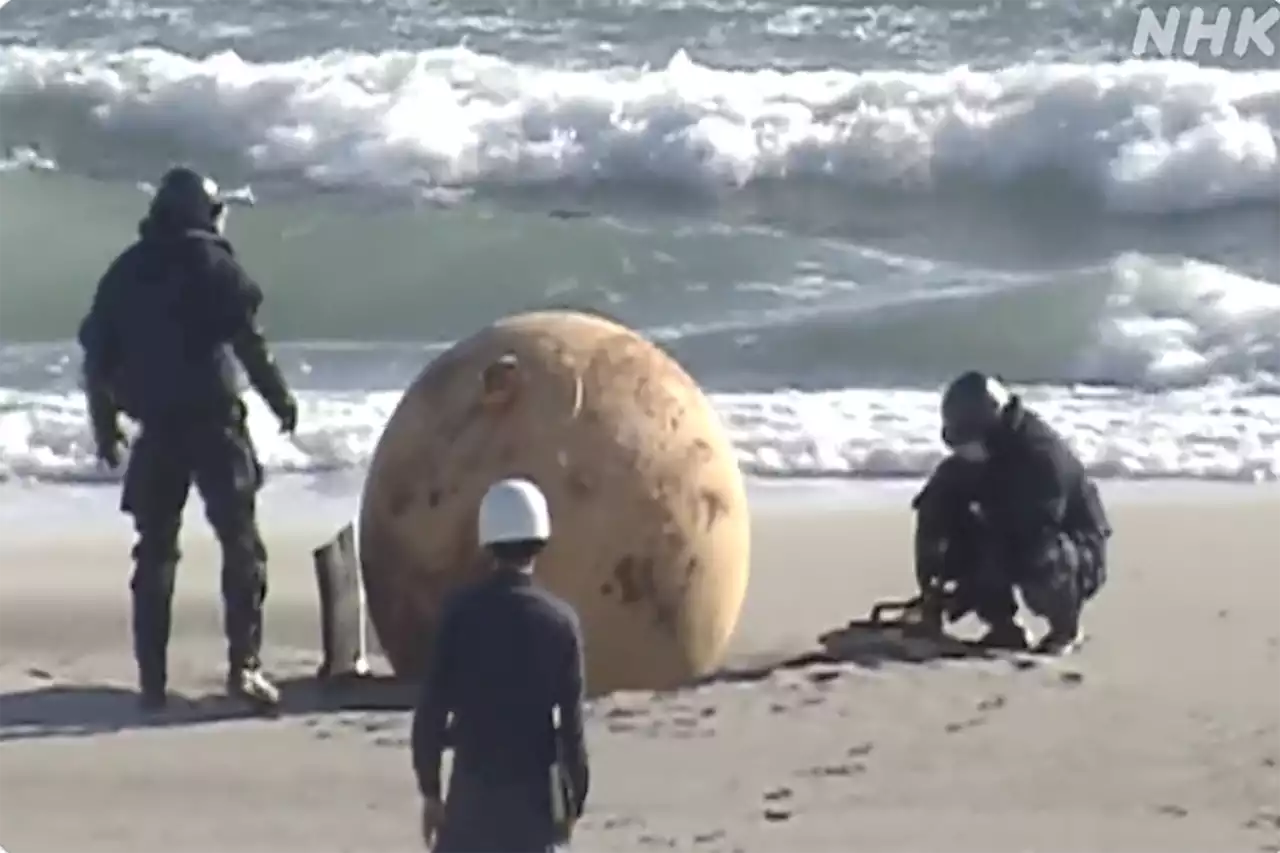 Japanese officials investigate mysterious sphere washed up on beach