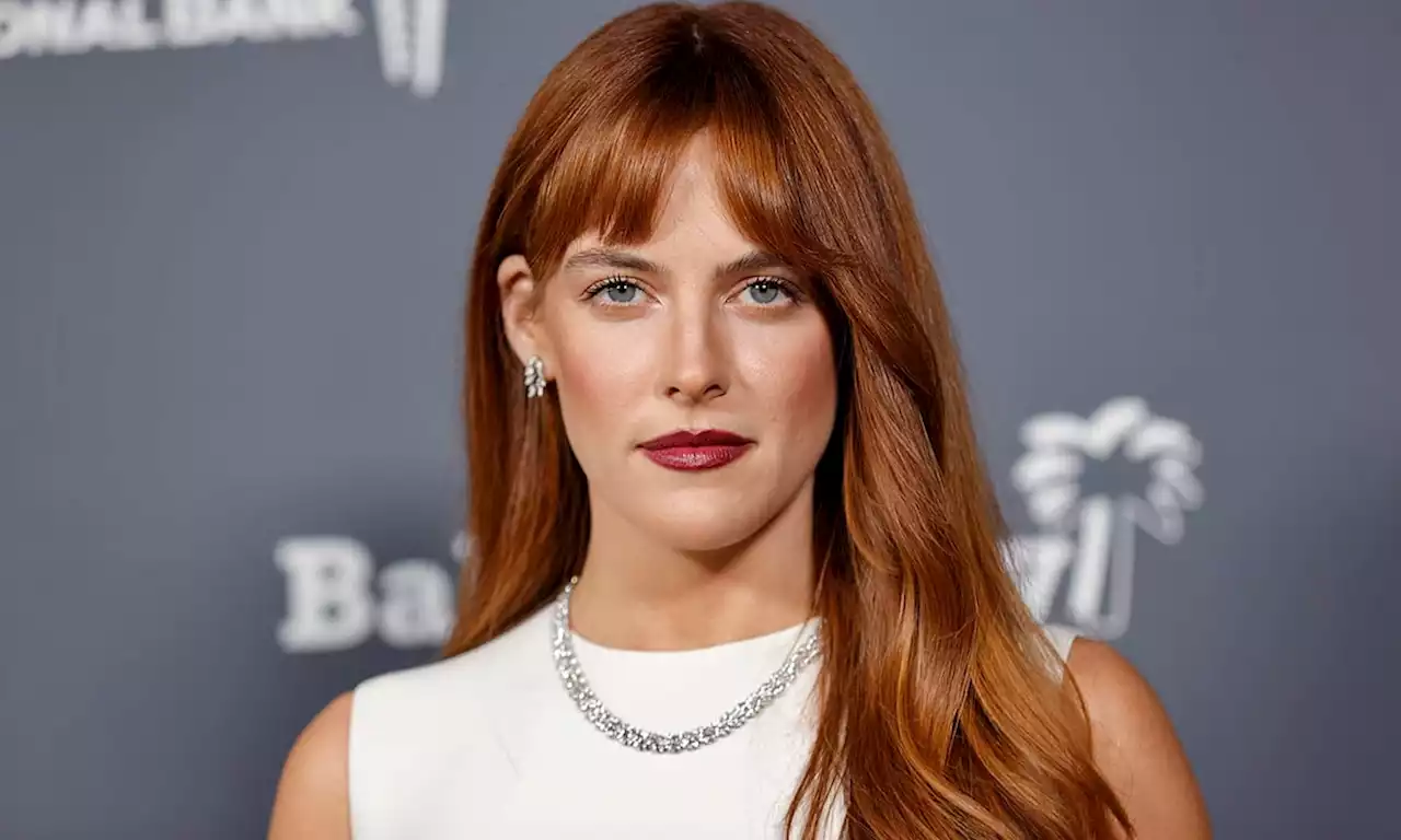 Riley Keough is a vision in slinky feathered cardigan and mini skirt