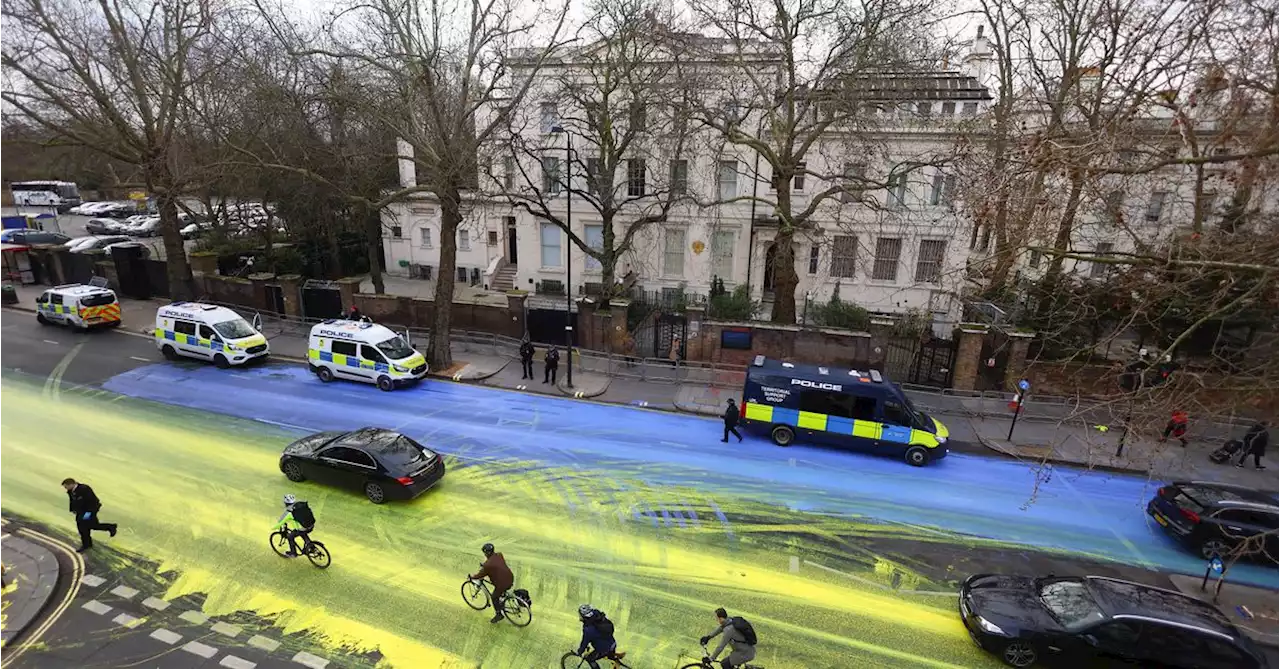 Huge Ukrainian flag painted on road outside Russian Embassy in London