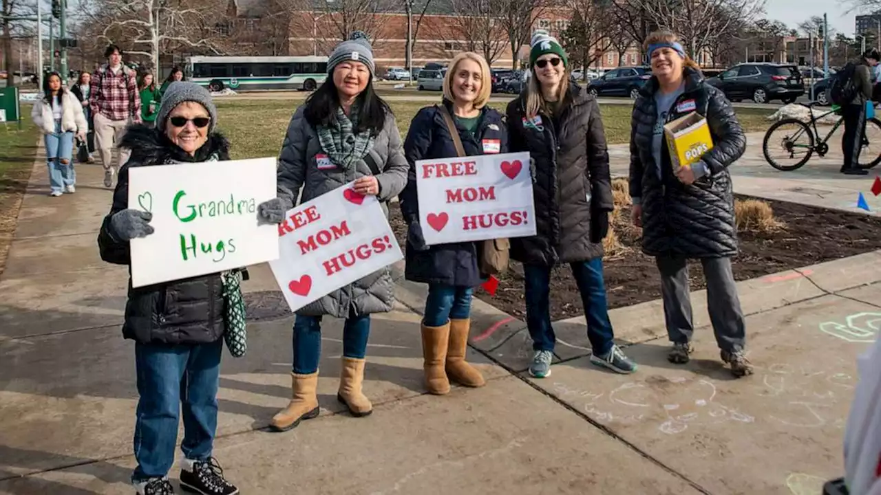 When students returned to Michigan State University after deadly shooting, moms were there to offer hugs