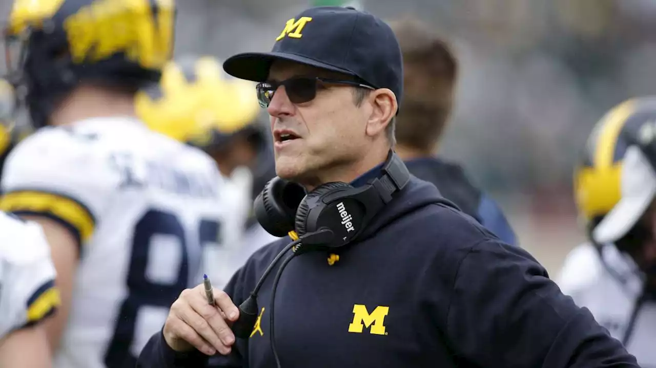 Have You Seen This? Jim Harbaugh helps police officer clear road after storm