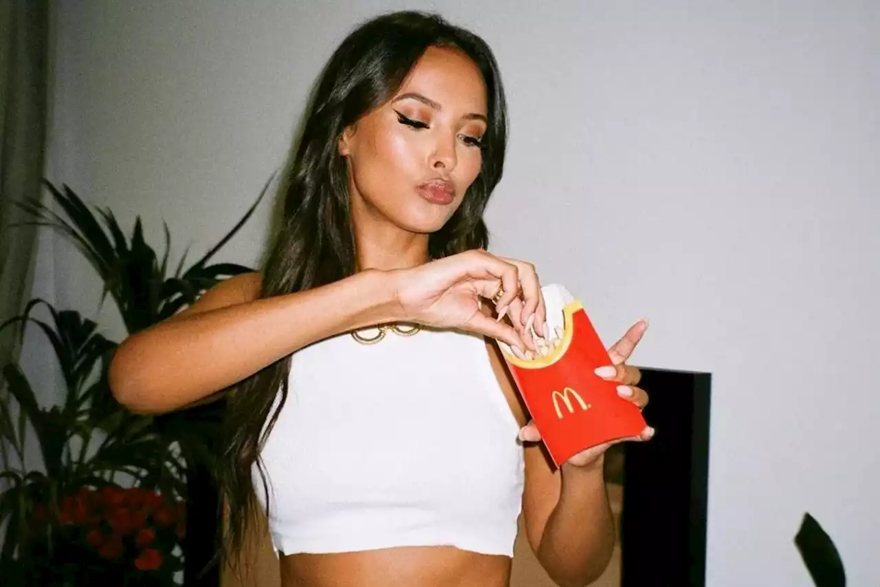 Maya Jama shows off her abs as she tucks into McDonald’s fries on sexy shoot