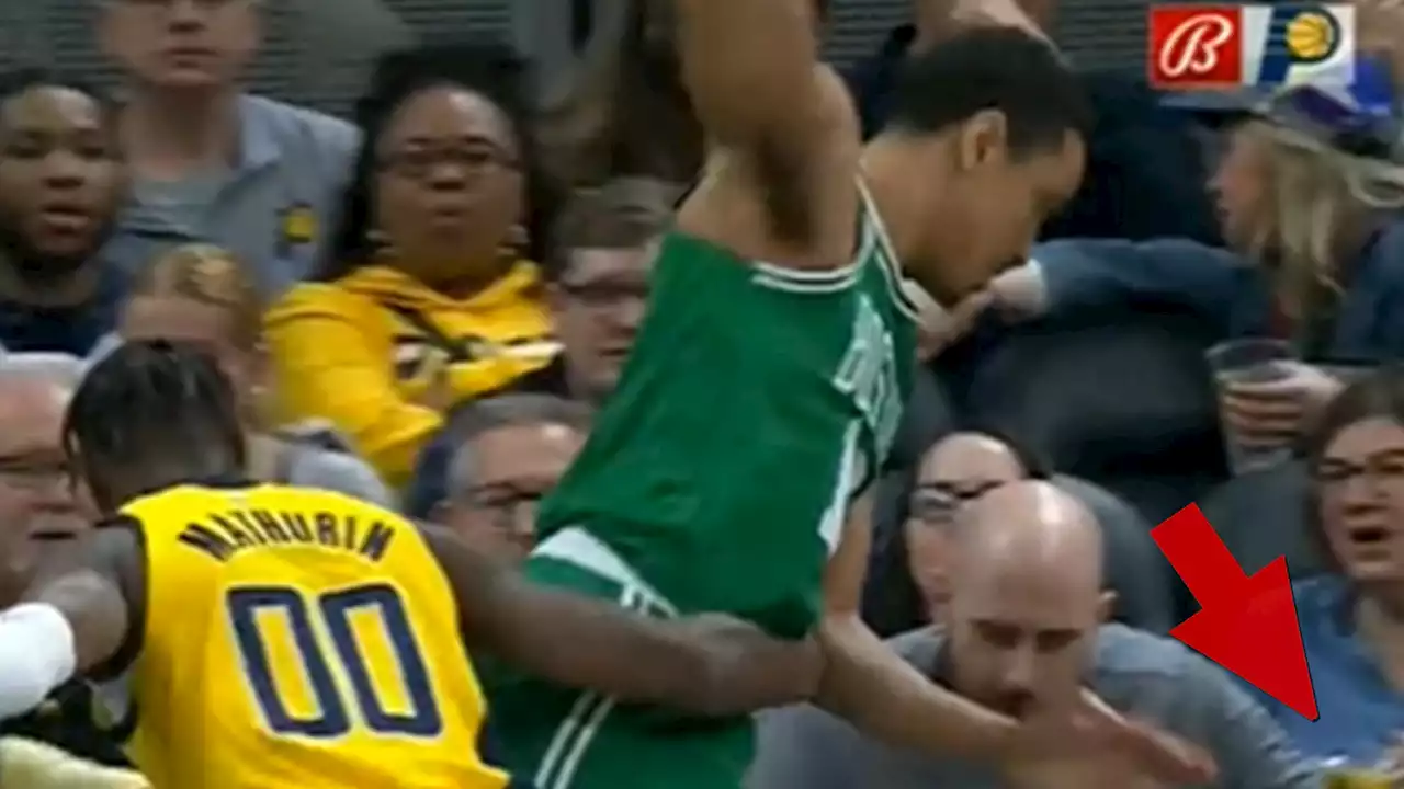 NBA's Malcolm Brogdon Falls Into Fan Sitting Courtside, Beer Spills Everywhere!