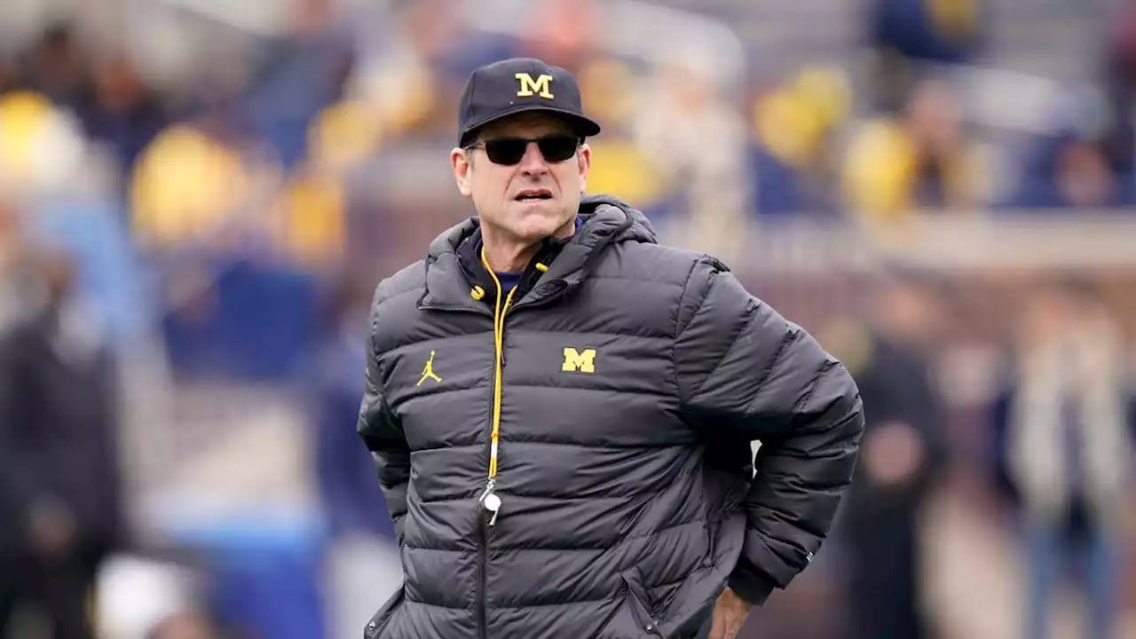 Watch: Good Samaritan\u00a0Jim Harbaugh helps Ann Arbor police clear road during ice storm