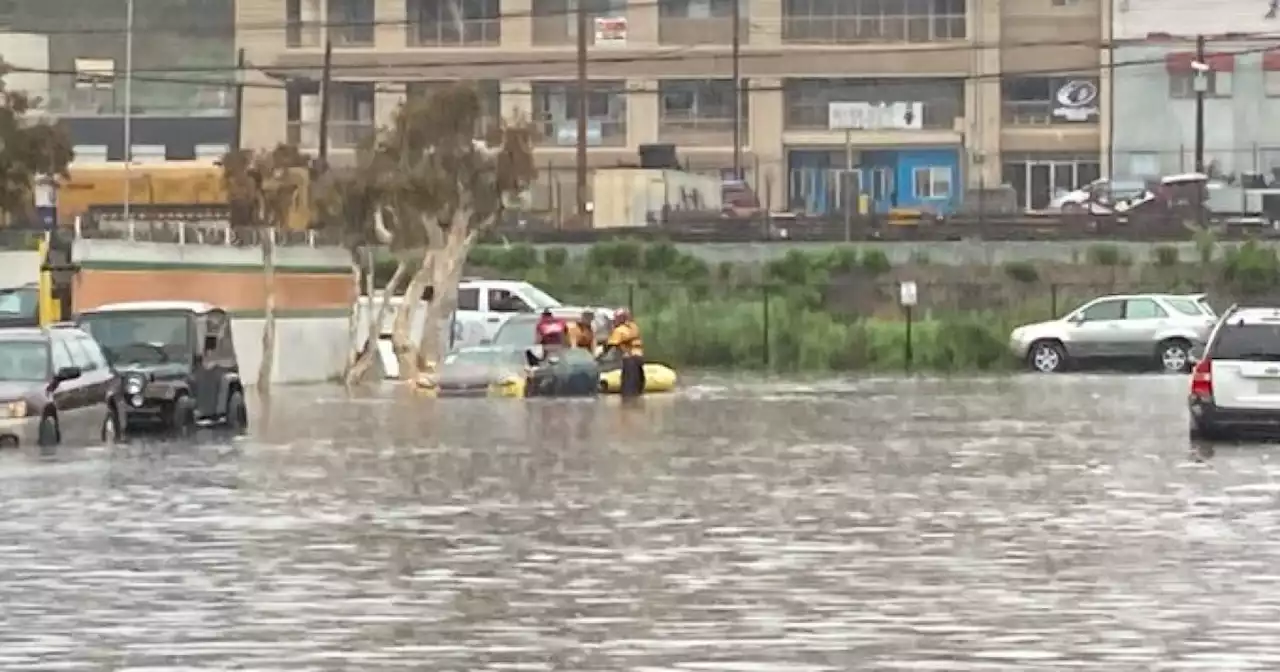 Lifeguards rescued 2 people from car trapped in flood water