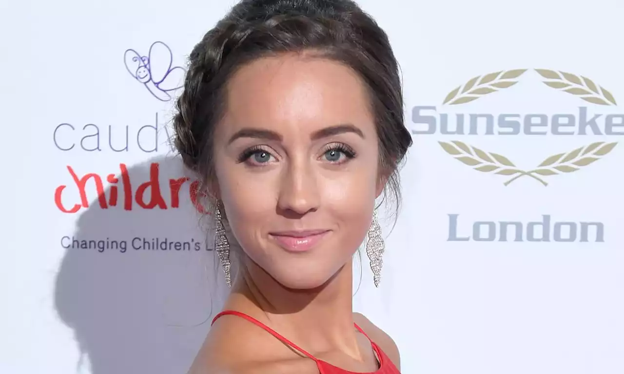 Emily Andre stuns in fabulous winter-chic overcoat for latest video