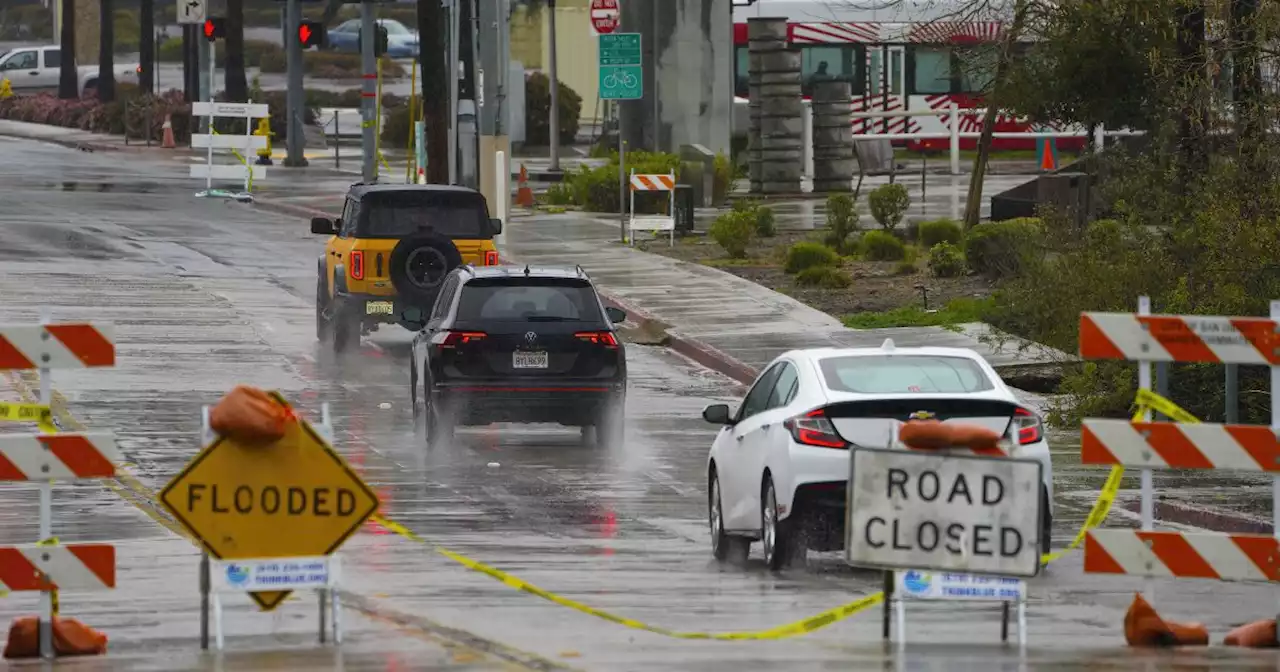 Tail end of Alaskan storm making freeways slick, flooding the San Diego River