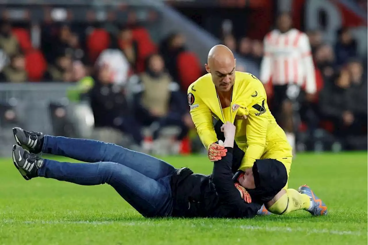 Soccer-UEFA opens probe after Sevilla keeper attacked by fan on pitch