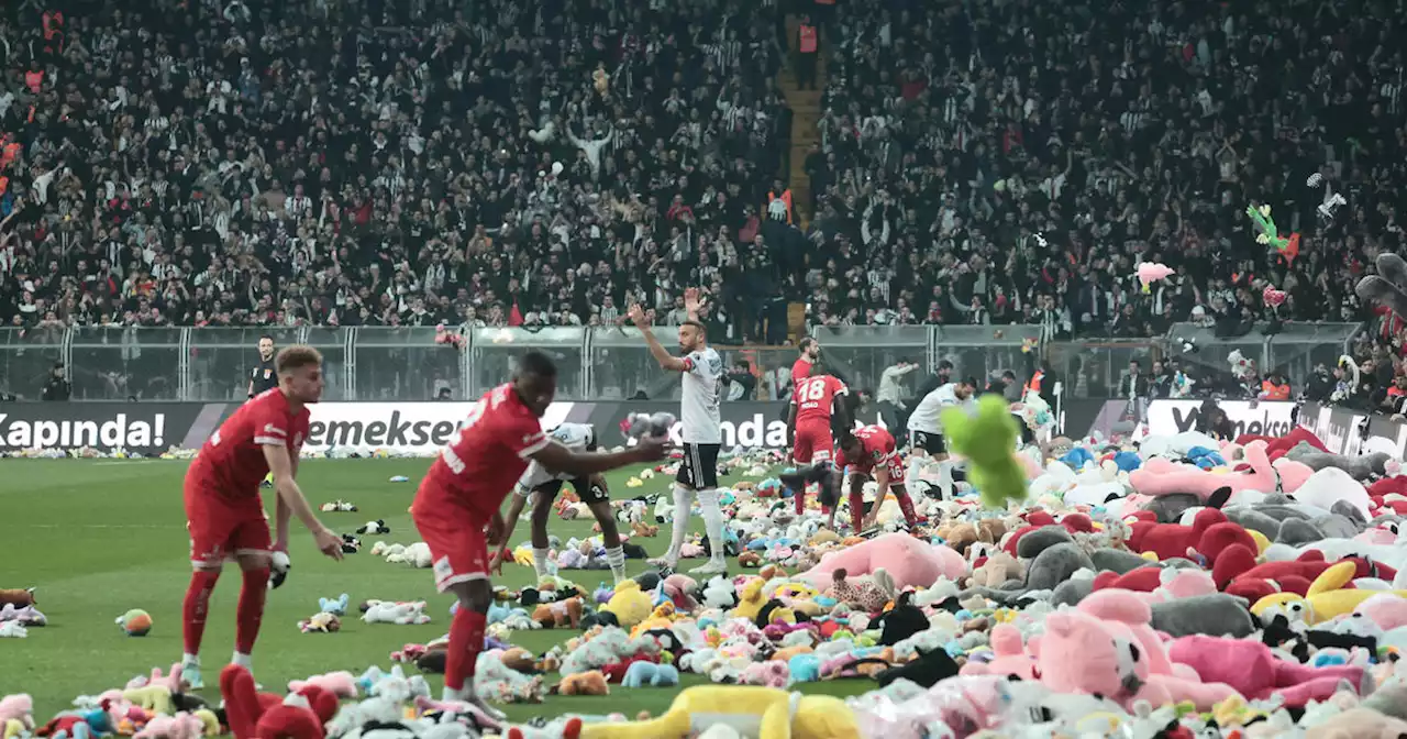 Fans throw stuffed toys onto soccer field for children affected by earthquakes in Turkey and Syria