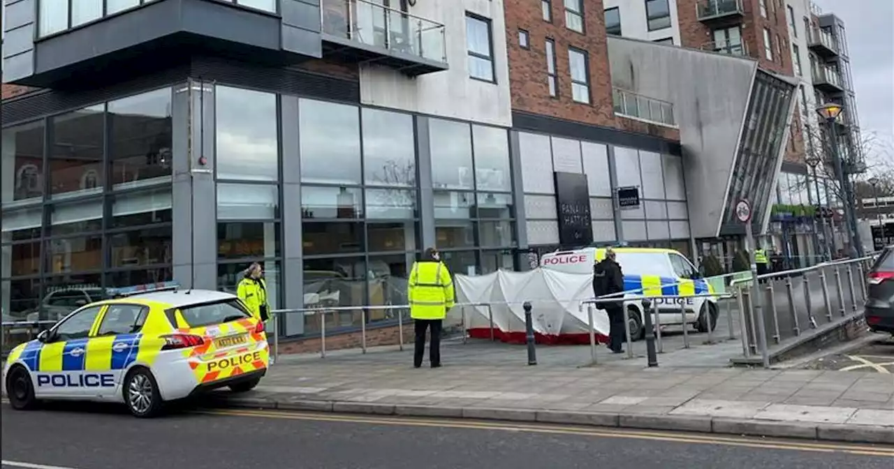 Police tape off town centre after man's body is found