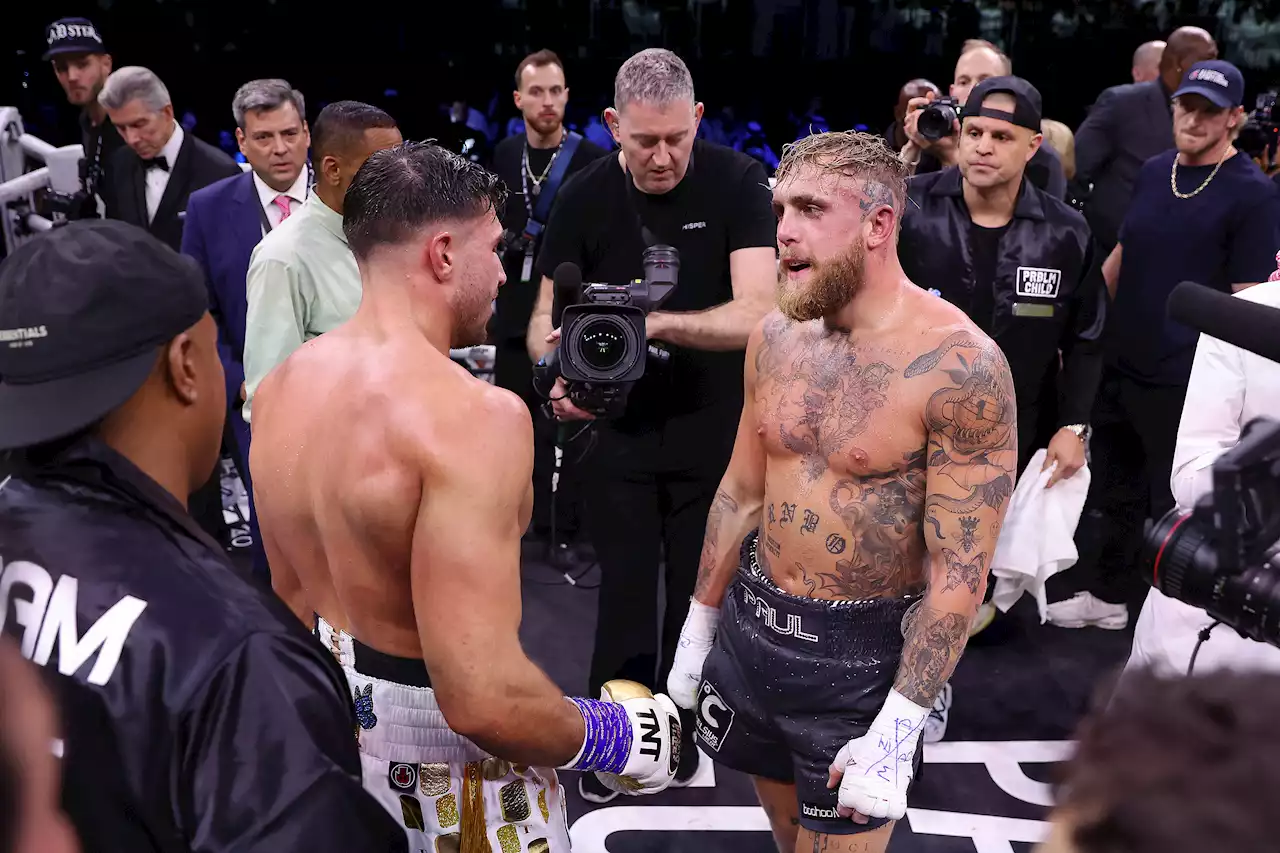 Jake Paul and Tommy Fury share moment of respect, while teary Brit says win was for partner Molly-Mae Hague and daughter Bambi