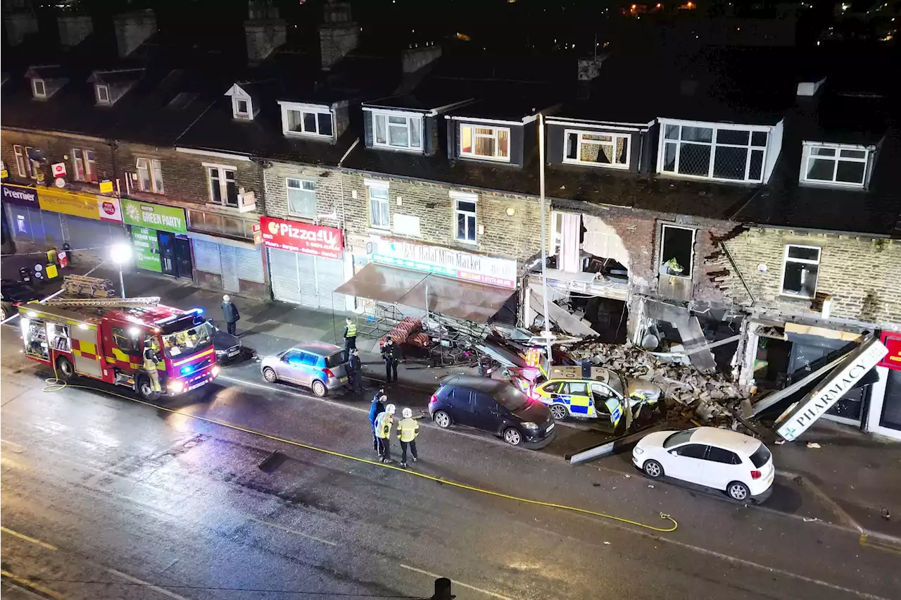 Dramatic photos show destroyed home after two police cars crashed into row of buildings in Bradford