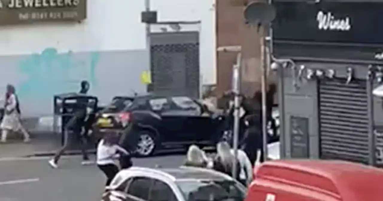 Hooded thugs in mass brawl outside Glasgow pub after Old Firm match