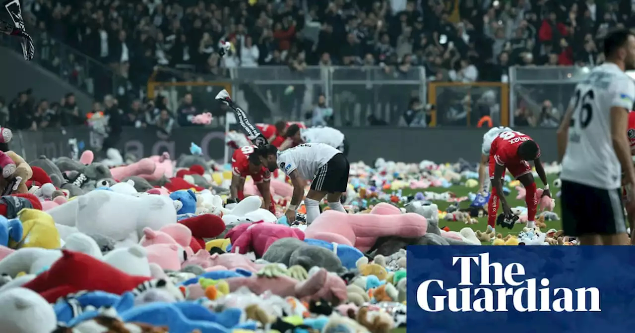 Besiktas fans throw toys on to pitch for children affected by earthquake