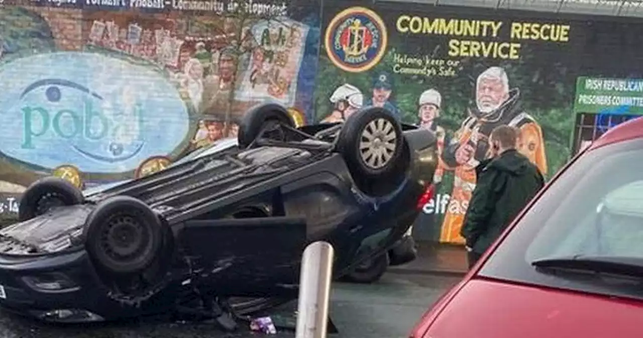 Woman taken to hospital after car overturns in Belfast