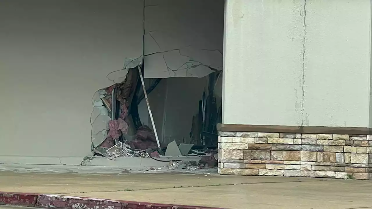 Woman pinned inside Alvin clothing store fitting room when driver crashes into building