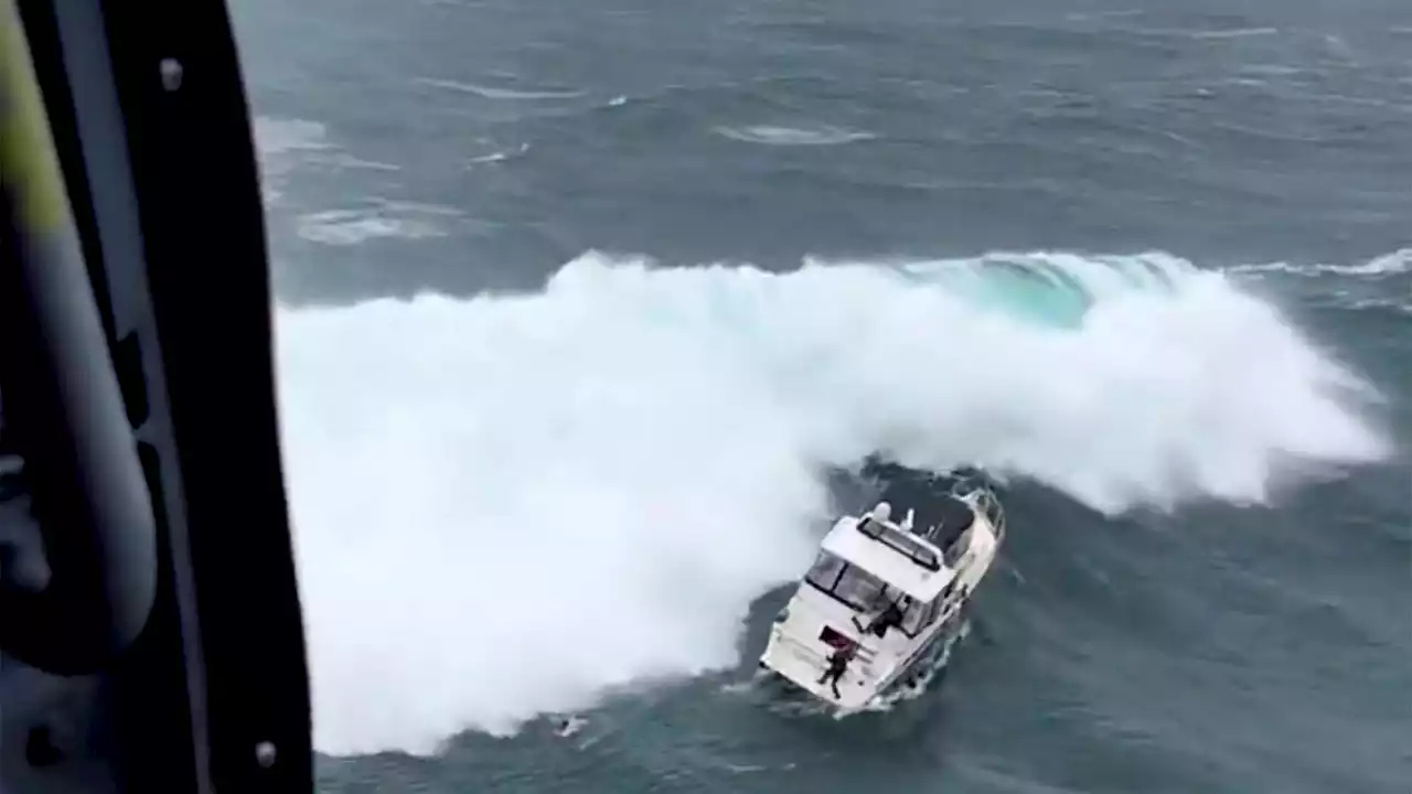 Coast Guard makes dramatic rescue as wave rolls yacht