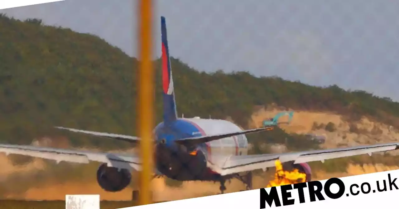 Russian plane carrying 321 tourists bursts into flames at 120 mph