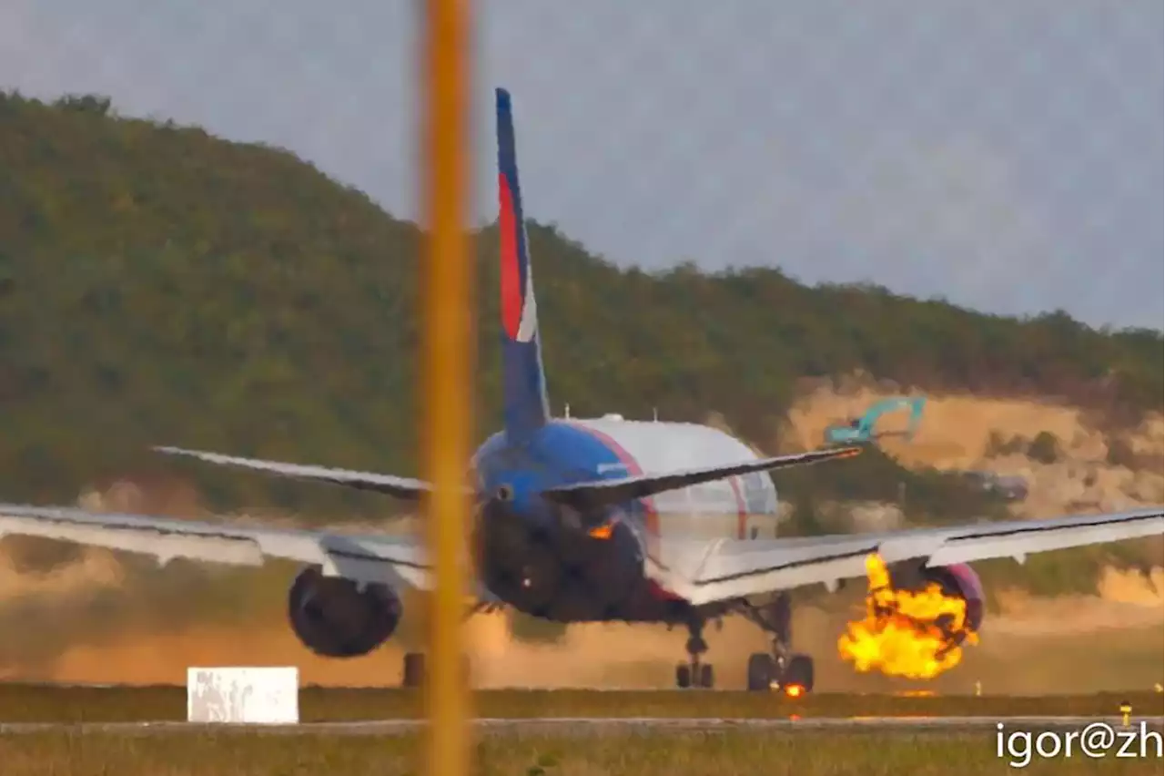 Tourist plane carrying 321 people has engine burst into flames at 120mph