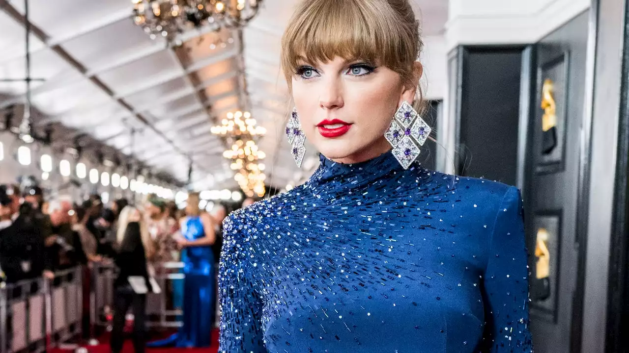 Taylor Swift hit the Grammys red carpet in a Midnights-inspired crop top