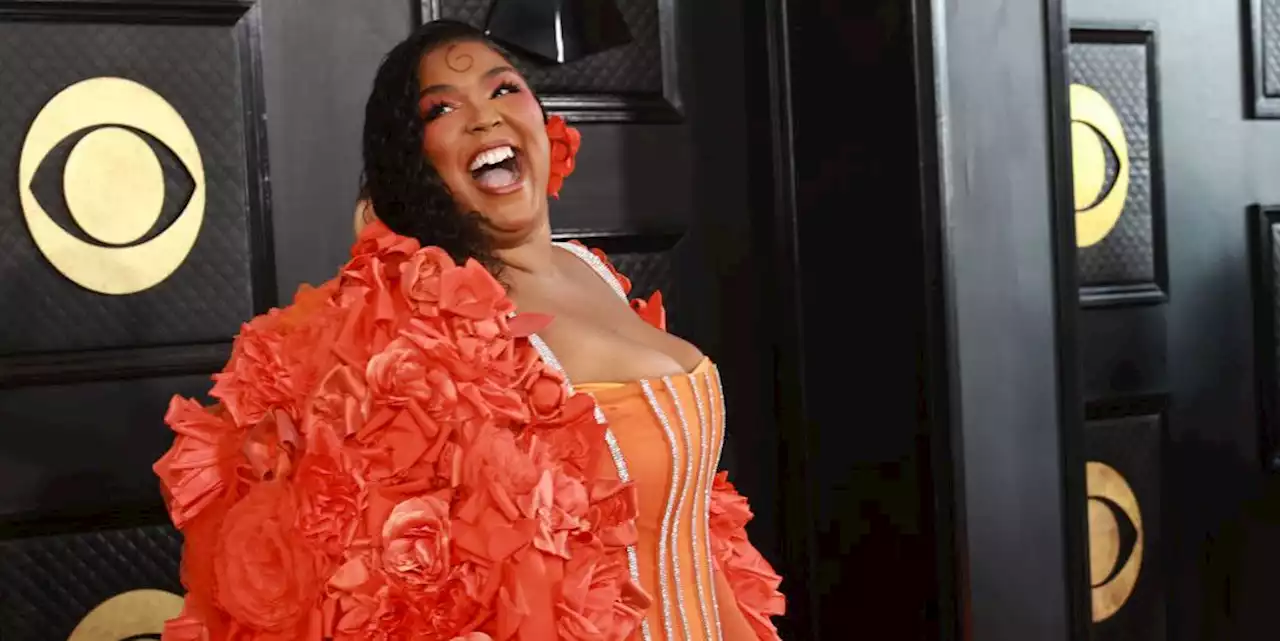 Lizzo Is Majestic in a Bright Orange Gown and Cape at the 2023 Grammys