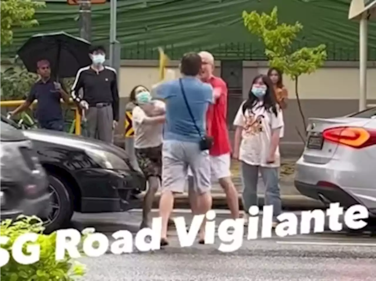 Singapore police investigating four people caught on viral video fighting on road