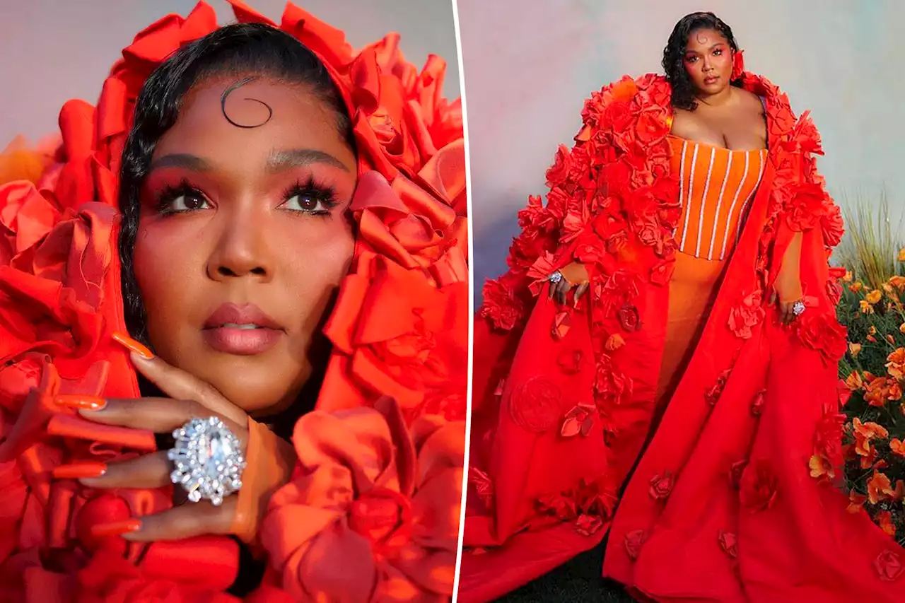 Lizzo looks peachy in corset and floral cape on Grammys 2023 red carpet