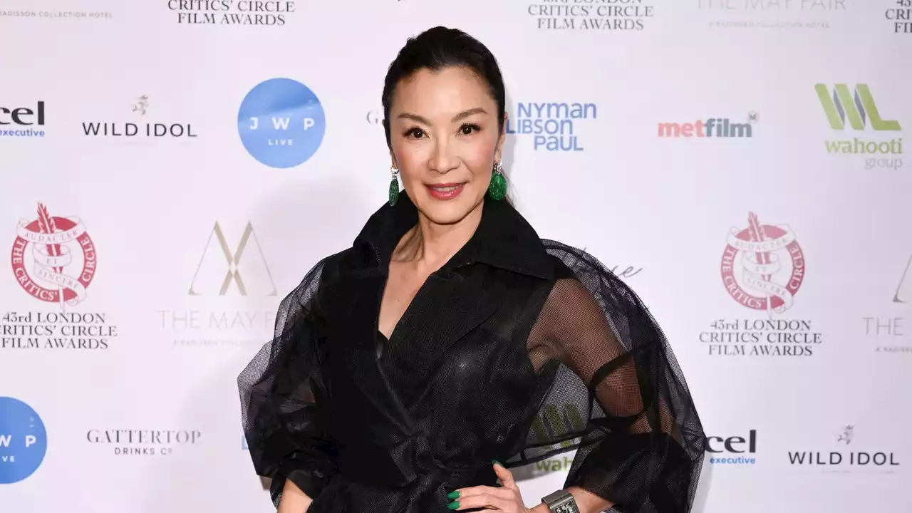 Michelle Yeoh Toughens Up A Sheer Trench With Platform Boots