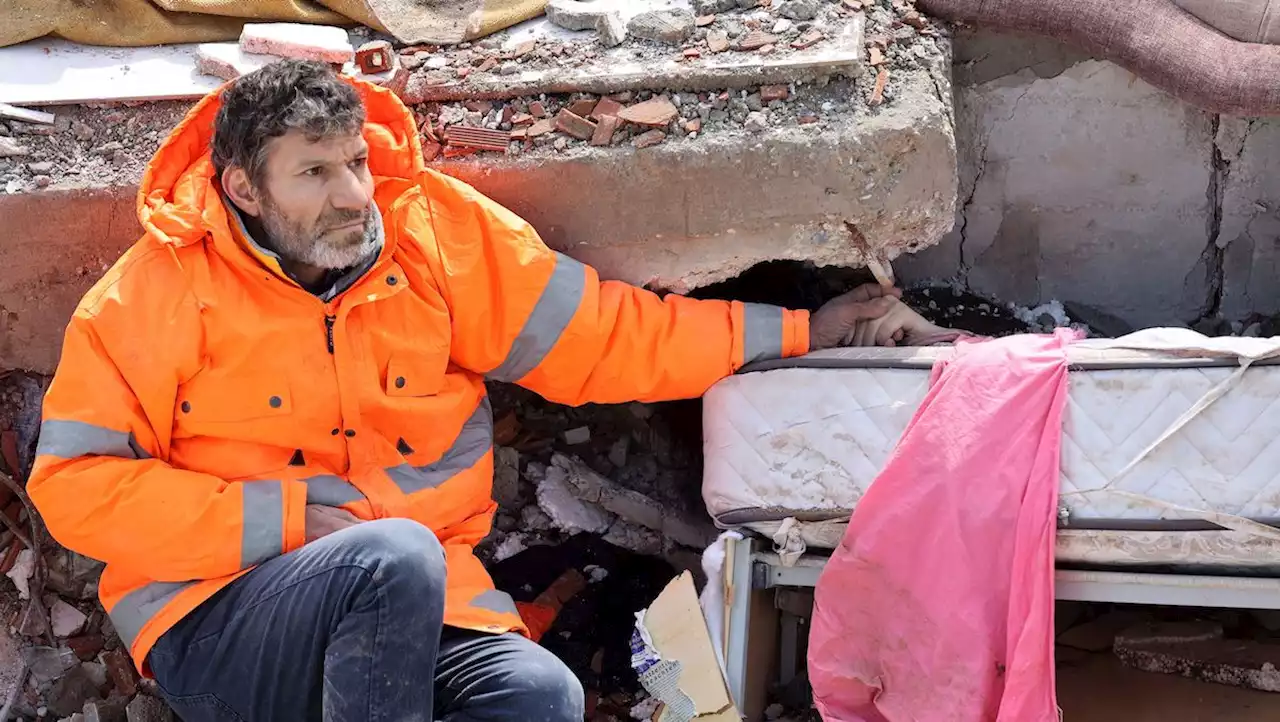 Turkish Father Holds On to Daughter's Hand as Rescuers Dig for Quake Survivors